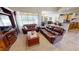 Spacious living room with large leather couches and sliding glass doors to lanai at 569 Royal Poinciana, Punta Gorda, FL 33955