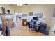 A spacious home office featuring a computer workstation, an armoire, and views into the living area at 569 Royal Poinciana, Punta Gorda, FL 33955