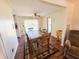 The dining room is spacious and well-lit, and has wood laminate flooring at 6821 Ocean Ct # Lot 30, North Port, FL 34287