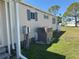 Side of home featuring utility, meter, and central A/C unit at 6821 Ocean Ct # Lot 30, North Port, FL 34287