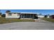 Charming mobile home with a carport and small front porch and decorative pink flamingos at 6821 Ocean Ct # Lot 30, North Port, FL 34287