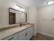 Bathroom with a vanity with drawers and cupboards, modern fixtures, and a large mirror at 908 Tropical Nw Cir, Port Charlotte, FL 33948