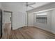 Bedroom with wood floors, closet, and bay window at 908 Tropical Nw Cir, Port Charlotte, FL 33948