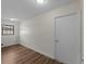 Bright bedroom with hardwood floors, a new window, and a closet at 908 Tropical Nw Cir, Port Charlotte, FL 33948