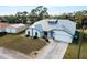 Stunning single Gathering home featuring a metal roof, attached garage and beautiful landscaping at 908 Tropical Nw Cir, Port Charlotte, FL 33948