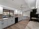 Modern kitchen with white cabinetry, granite countertops, and stainless steel appliances at 908 Tropical Nw Cir, Port Charlotte, FL 33948