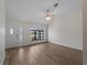 Living room with light colored walls, windows, and plank flooring at 908 Tropical Nw Cir, Port Charlotte, FL 33948
