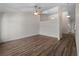 Living room with neutral colored walls, plank flooring, and a ceiling fan at 908 Tropical Nw Cir, Port Charlotte, FL 33948