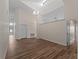 Bright and airy living area featuring high ceilings, modern lighting, and a neutral color palette at 908 Tropical Nw Cir, Port Charlotte, FL 33948
