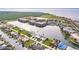 Expansive aerial view of a waterfront community featuring homes nestled along canals at 103 Colony Point Dr, Punta Gorda, FL 33950