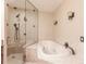 Modern bathroom featuring a glass-enclosed shower with a soaking tub at 103 Colony Point Dr, Punta Gorda, FL 33950