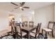 Dining area with modern decor featuring a square table and adjacent kitchen and living area at 103 Colony Point Dr, Punta Gorda, FL 33950