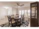 Bright dining room features a ceiling fan, large windows, and a decorative rug at 103 Colony Point Dr, Punta Gorda, FL 33950