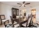 Well-lit dining area with modern furniture, decorative rug, and a china cabinet at 103 Colony Point Dr, Punta Gorda, FL 33950