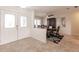 Inviting foyer flows into the dining area, showcasing tile floors and elegant double doors with decorative glass at 103 Colony Point Dr, Punta Gorda, FL 33950