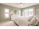Comfortable primary bedroom with sliding glass doors leading to pool and ensuite bathroom at 103 Colony Point Dr, Punta Gorda, FL 33950