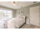 Relaxing bedroom with sliding glass doors that lead to a screened lanai and pool at 103 Colony Point Dr, Punta Gorda, FL 33950