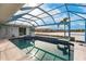 View of pool and lake from screened in lanai at 103 Colony Point Dr, Punta Gorda, FL 33950