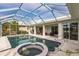 View of pool and spa from screened in lanai at 103 Colony Point Dr, Punta Gorda, FL 33950