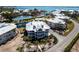 Stunning aerial view of a condo surrounded by water, lush landscaping, and community amenities at 11000 Placida Rd # 1501, Placida, FL 33946