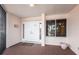 A welcoming condo entrance with double doors, brick floor and views of the lush landscaping at 11000 Placida Rd # 1501, Placida, FL 33946