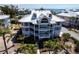 Gorgeous elevated exterior view of condo building with lovely balconies and landscaping at 11000 Placida Rd # 1501, Placida, FL 33946