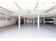 Large parking garage with two cars parked inside, offering protection from the elements at 11000 Placida Rd # 1501, Placida, FL 33946