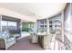 Relaxing screened patio with comfortable wicker furniture and glass-top dining table at 11000 Placida Rd # 1501, Placida, FL 33946