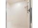 Bathroom shower with a built-in seat, handheld sprayer, and tiled walls at 11000 Placida Rd # 1501, Placida, FL 33946