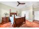 Bright bedroom features tile flooring, ceiling fan, and closet at 1111 San Mateo Dr, Punta Gorda, FL 33950