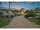 Elegant mediterranean home with lush landscaping, a circular driveway, and a welcoming tower entrance at 1111 San Mateo Dr, Punta Gorda, FL 33950