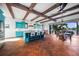 Stylish kitchen featuring custom cabinets, a spacious island with seating, and an open layout to the outdoor area at 1111 San Mateo Dr, Punta Gorda, FL 33950