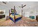 Large bedroom with ensuite bath, ceiling fan and terra cotta flooring throughout at 1111 San Mateo Dr, Punta Gorda, FL 33950