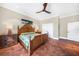 This main bedroom features tile floors, a ceiling fan, and a closet at 1111 San Mateo Dr, Punta Gorda, FL 33950