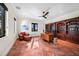 Office with custom shelving, natural lighting, and terra cotta flooring throughout at 1111 San Mateo Dr, Punta Gorda, FL 33950