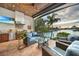 Enjoy the outdoor kitchen and seating area with a canal view, perfect for entertaining and relaxation at 1111 San Mateo Dr, Punta Gorda, FL 33950