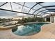 Relax in this screened-in pool and hot tub with views of the canal, blending luxury and outdoor living at 1111 San Mateo Dr, Punta Gorda, FL 33950