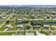 Aerial view of a home with lush landscaping and water access at 131 Buckeye Nw Ave, Port Charlotte, FL 33952