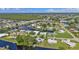 An aerial view of a canal-front community with waterfront homes at 131 Buckeye Nw Ave, Port Charlotte, FL 33952