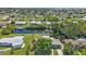 Aerial view of neighborhood homes, lush greenery, and waterfront access, ideal for relaxed living and outdoor activities at 131 Buckeye Nw Ave, Port Charlotte, FL 33952