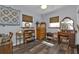 Well-lit bedroom featuring wooden floors, a dresser, and a vanity at 131 Buckeye Nw Ave, Port Charlotte, FL 33952