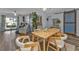 A modern dining room featuring stylish furniture, a sliding barn door, and plenty of natural light at 131 Buckeye Nw Ave, Port Charlotte, FL 33952