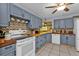 Charming kitchen with blue cabinets, wood countertops, and stylish backsplash at 131 Buckeye Nw Ave, Port Charlotte, FL 33952