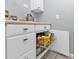 Well-organized kitchen with pull-out drawers, offering convenient storage solutions for pantry items and kitchen essentials at 131 Buckeye Nw Ave, Port Charlotte, FL 33952