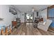 Spacious living room showcasing wood-look floors, antique furnishings, and plenty of natural light at 131 Buckeye Nw Ave, Port Charlotte, FL 33952