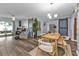 A bright living and dining area featuring a barn door, and an inviting atmosphere at 131 Buckeye Nw Ave, Port Charlotte, FL 33952