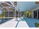 Enclosed patio area with a swimming pool, comfortable seating, and a serene atmosphere, perfect for outdoor enjoyment at 131 Buckeye Nw Ave, Port Charlotte, FL 33952