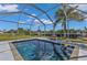 Inviting screened pool with a clear blue water and outdoor views at 131 Buckeye Nw Ave, Port Charlotte, FL 33952
