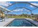 A beautiful screened pool with a clear blue water and plenty of space for lounging at 131 Buckeye Nw Ave, Port Charlotte, FL 33952