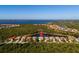 An overhead view displays a beautiful waterfront home nestled in a serene community near a vast expanse of water at 13352 Creekside Ln, Port Charlotte, FL 33953